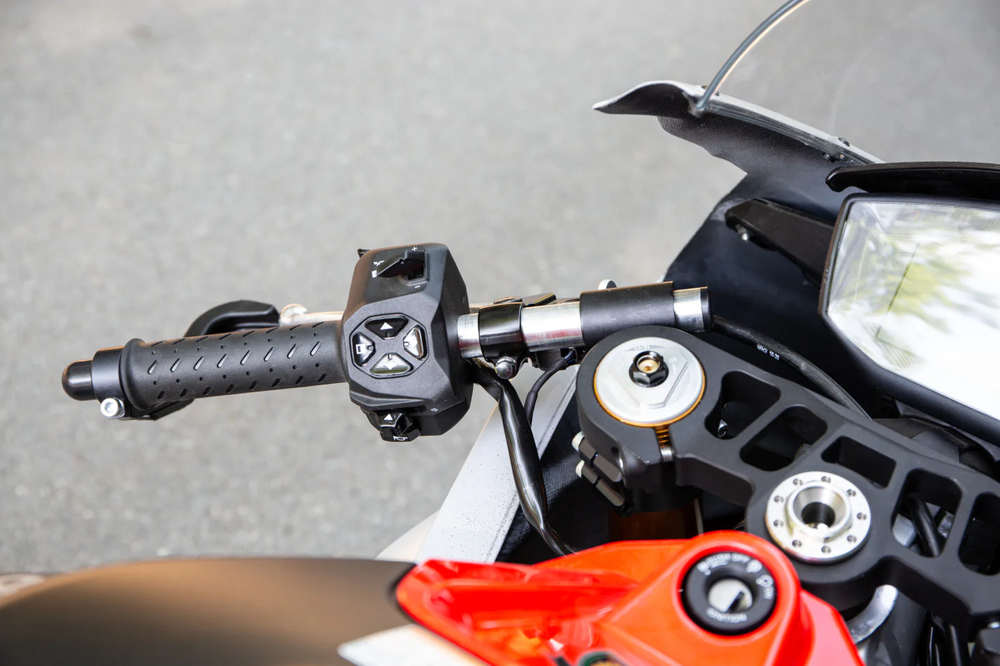 Close-up of motorcycle handlebar and front section.
